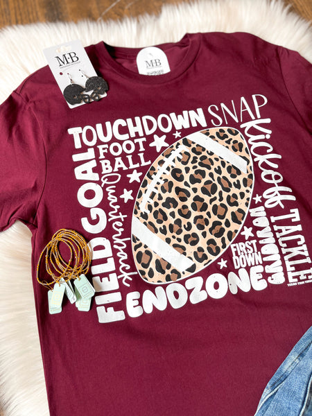 Leopard Football with Scattered Words Tee - Maroon